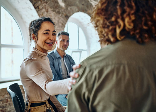 smiling woman providing a supportive service